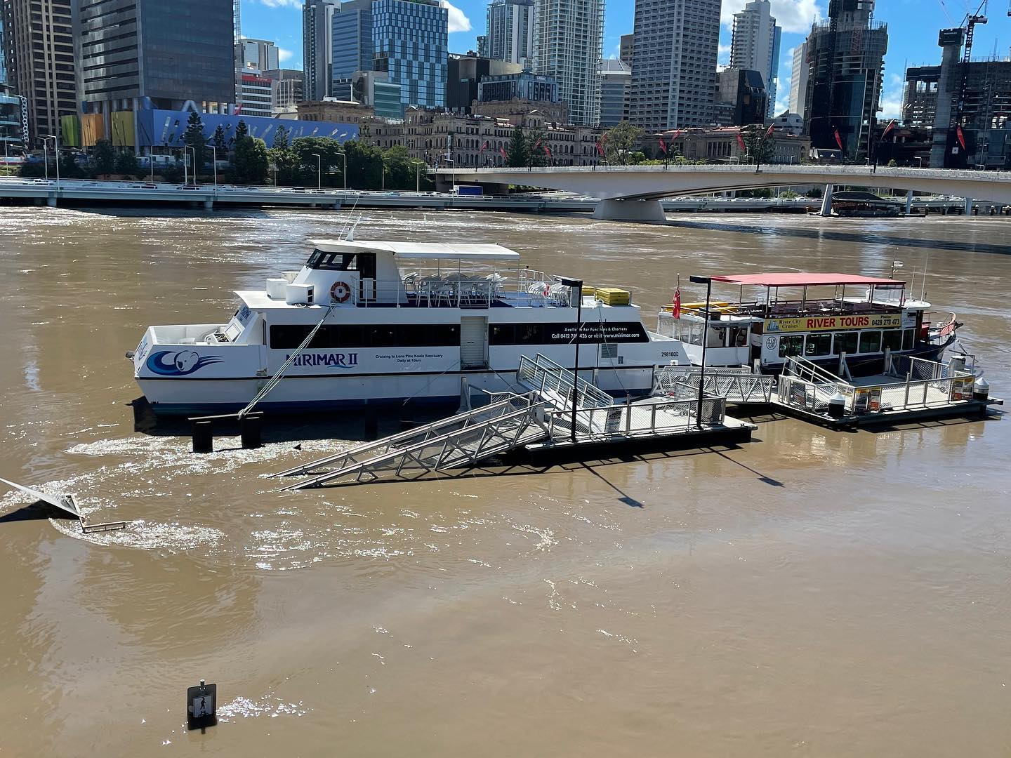 Mirimar II During the 2022 Brisbane Flood Mirimar II moored at the Cultural Centre Pontoon during the 2022 Brisbane Flood, with floodwaters submerging the South Bank boardwalk and surrounding riverside infrastructure beneath several metres of water. Brisbane's CBD skyline rises in the background, highlighting the scale of the flood.